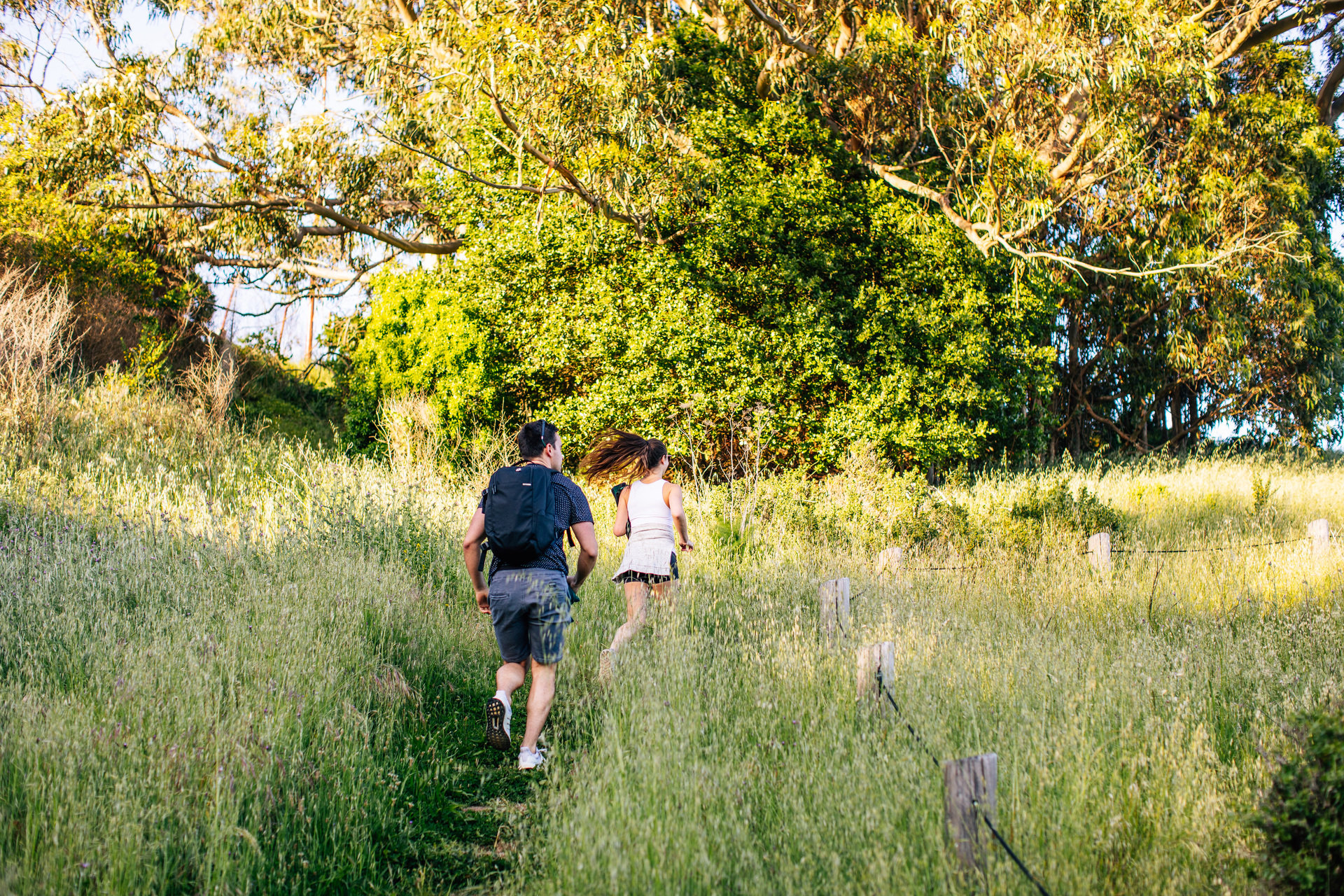 couple running up stairs outdoors