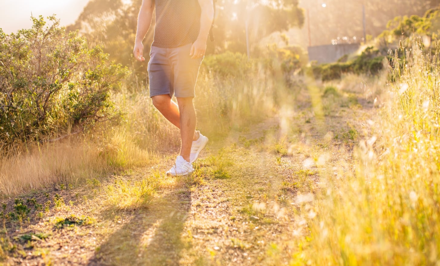 man legs hiking sunny
