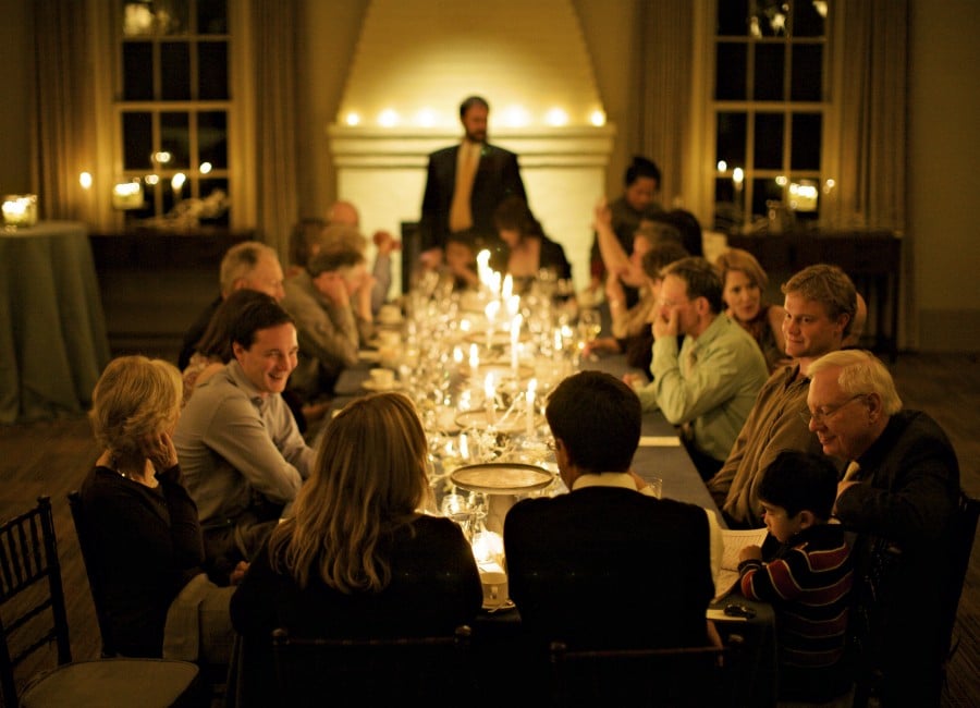 Group at large candle light dinning table