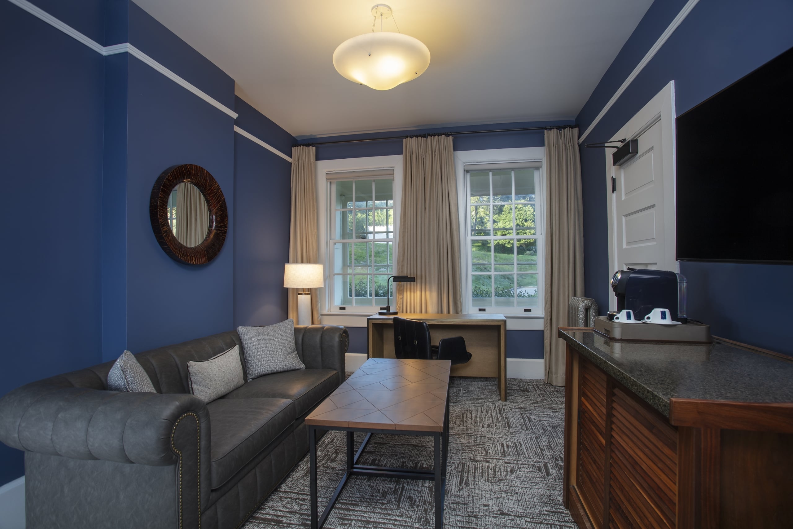 Historic room sitting area with couch, table, chair