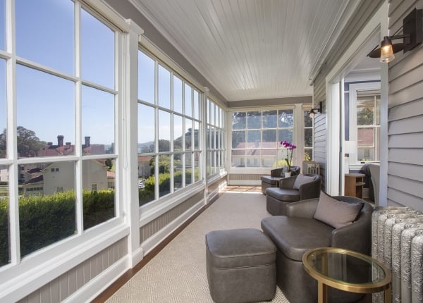 indoor seating area with two chairs and windows overlooking the Golden Gate Bridge
