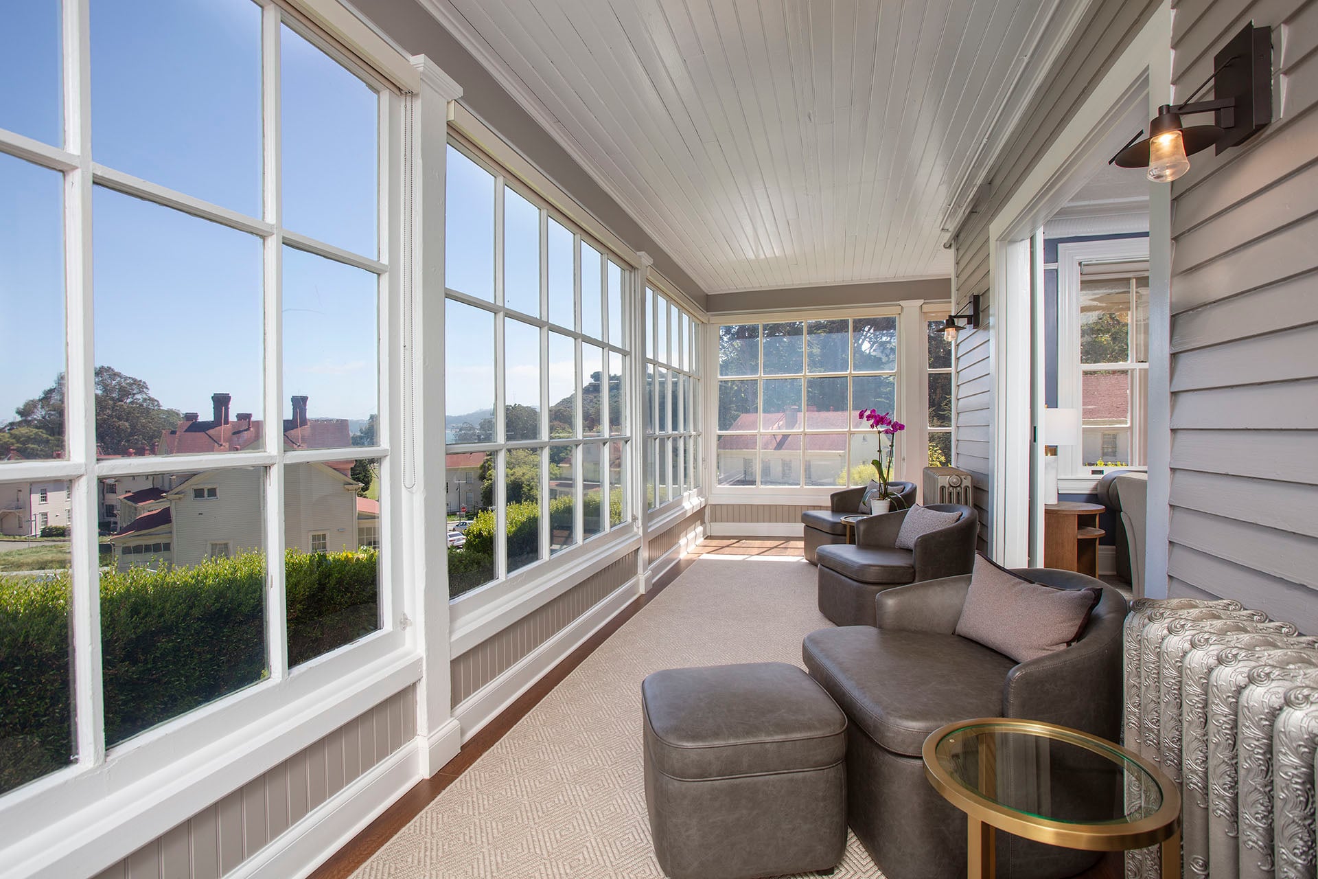 indoor seating area with two chairs and windows overlooking the Golden Gate Bridge
