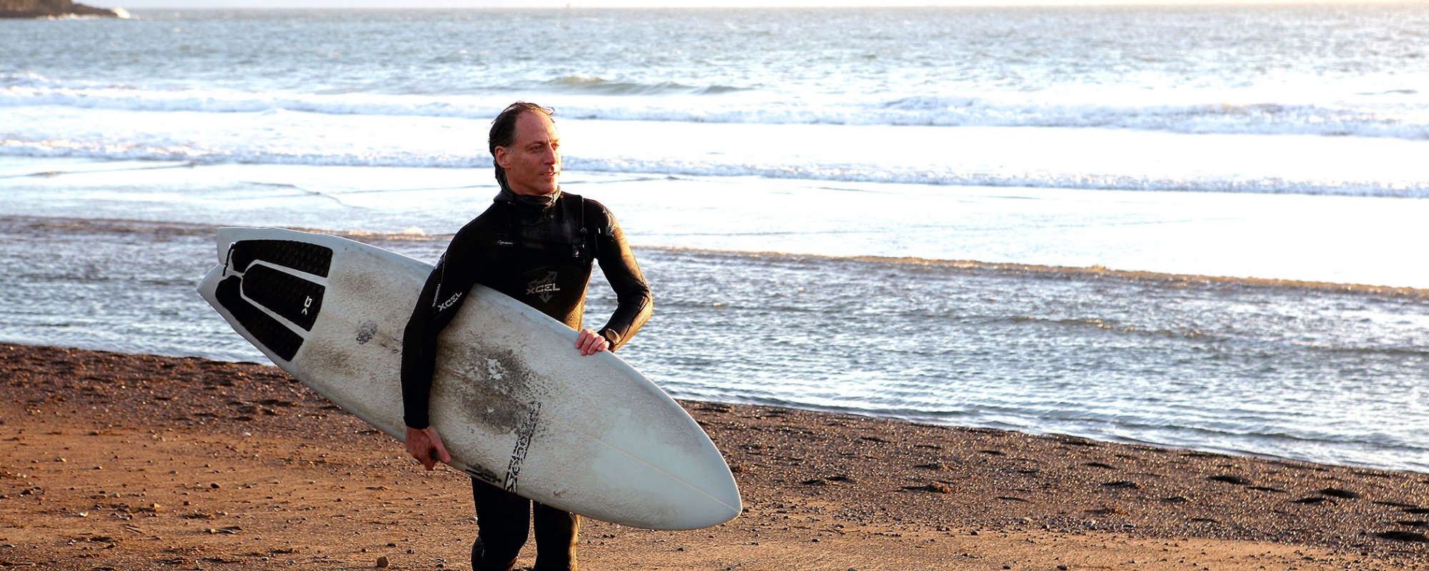 Dr. Bradly with surfboard