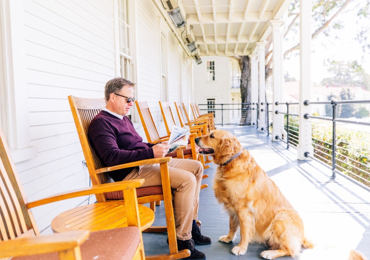 Man with Dog on Porch