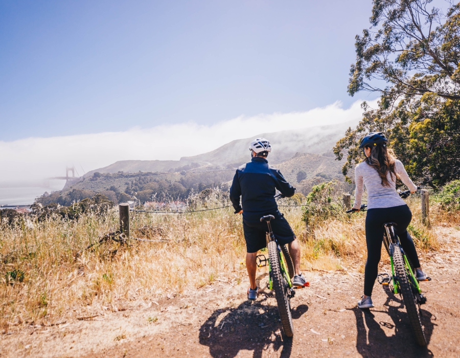 Couple biking on trail