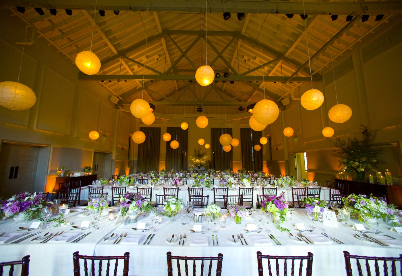 Wedding venue large table and paper lamps