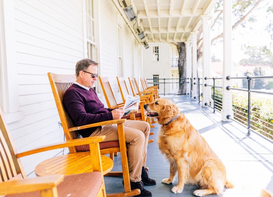 Man with Dog on Porch