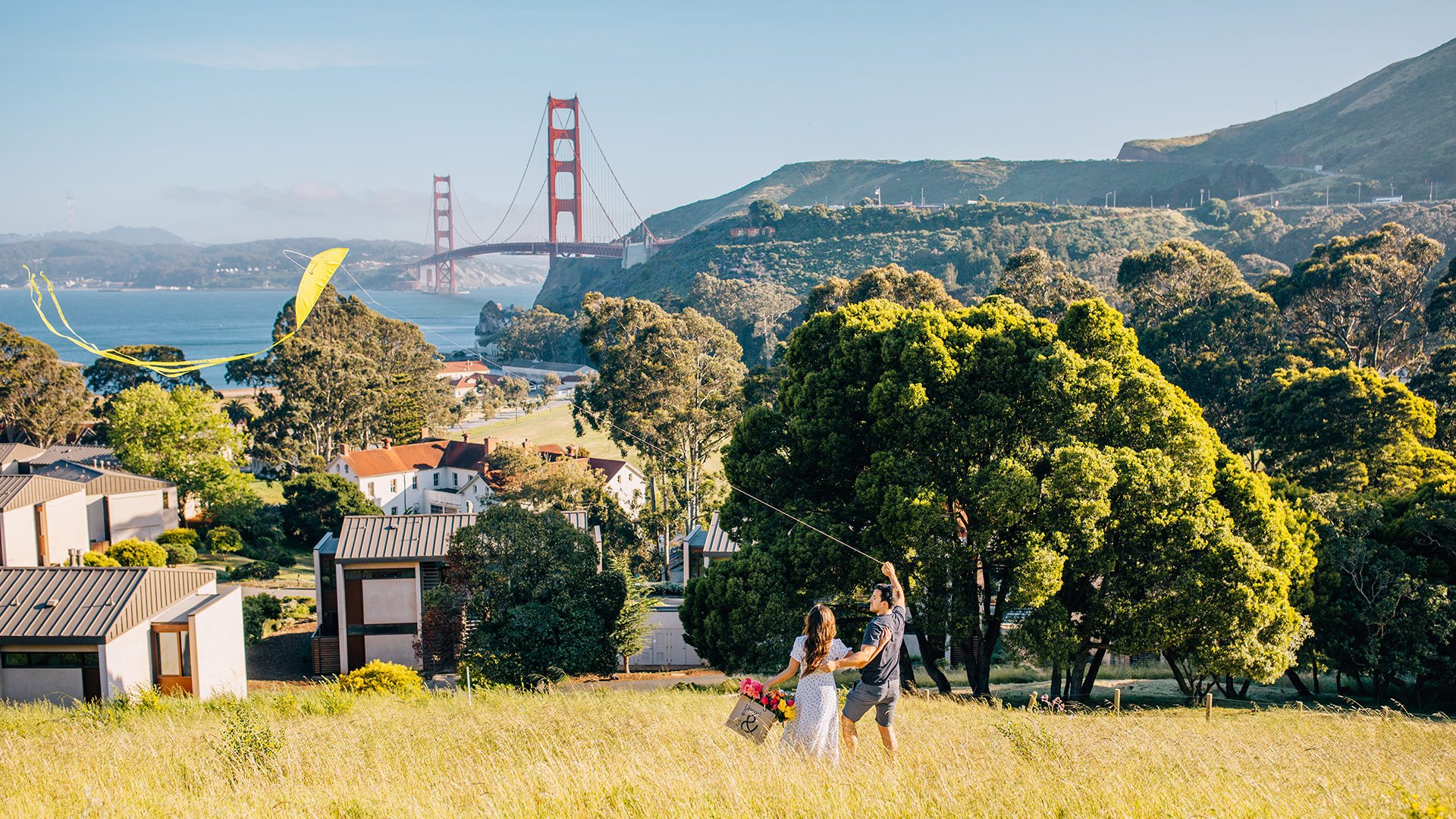 people flying a kite in the hills above cavallo point