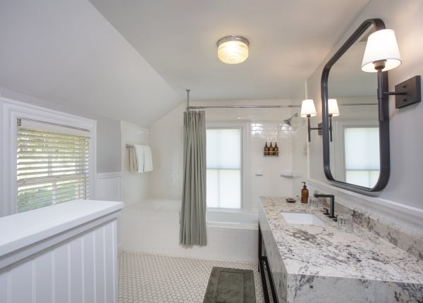 White bathroom with a marble vanity