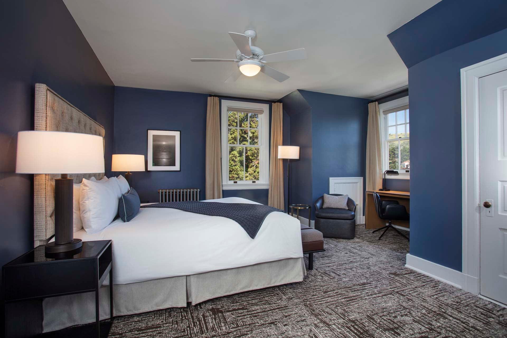 Master bedroom with King bed, desk and chair