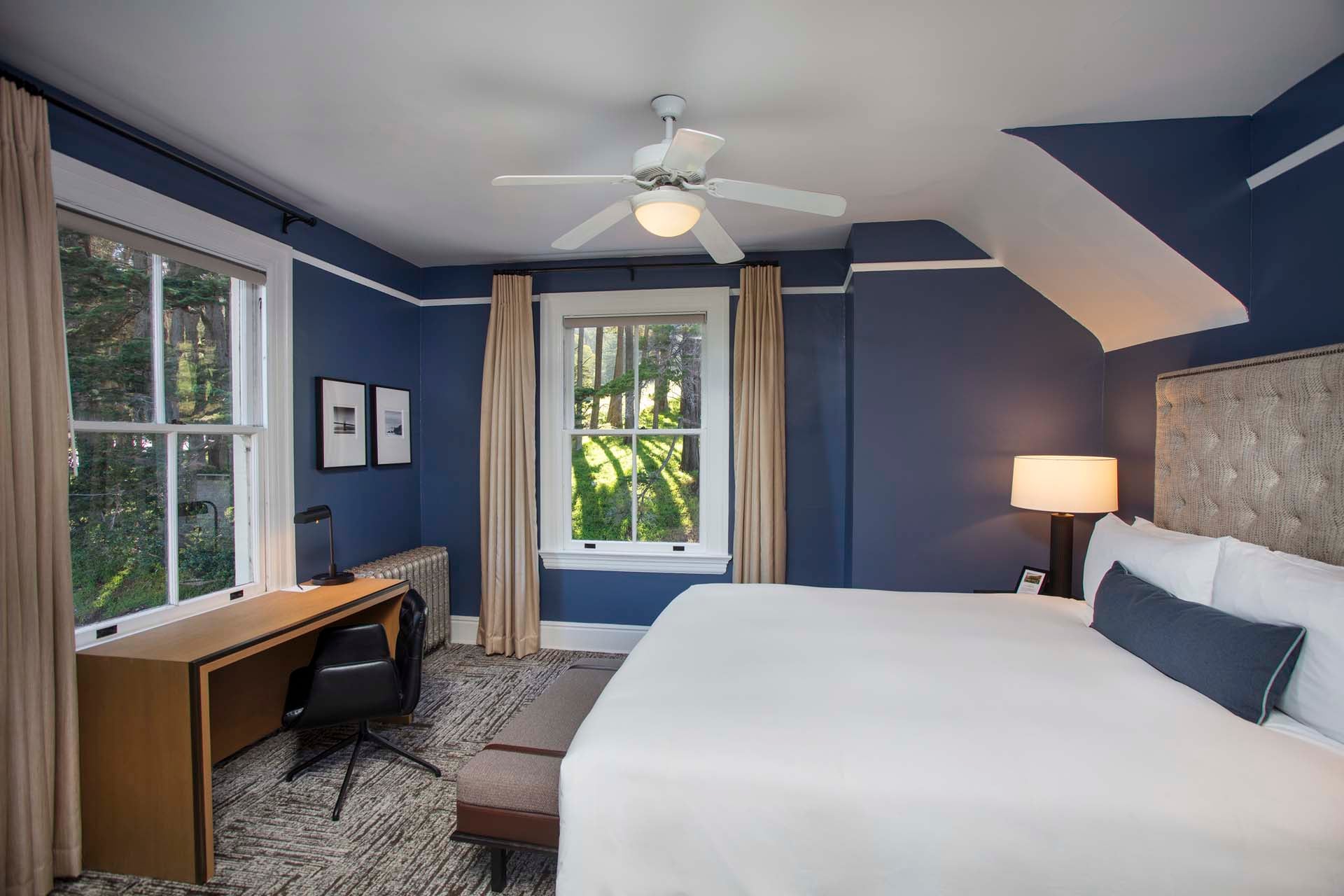 Bedroom with a King bed and desk with desk chair