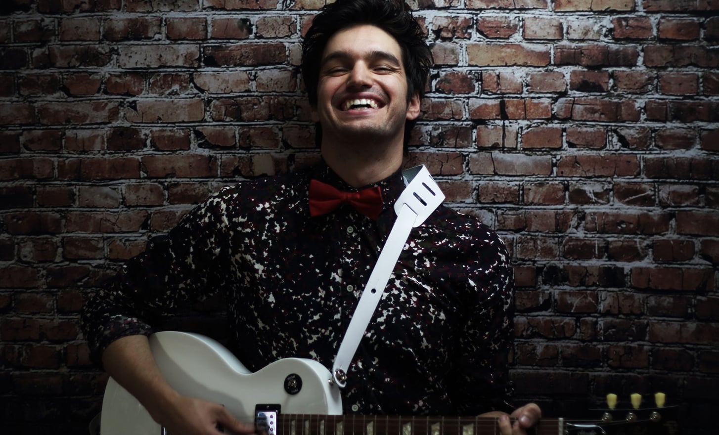 john vicino holding a guitar