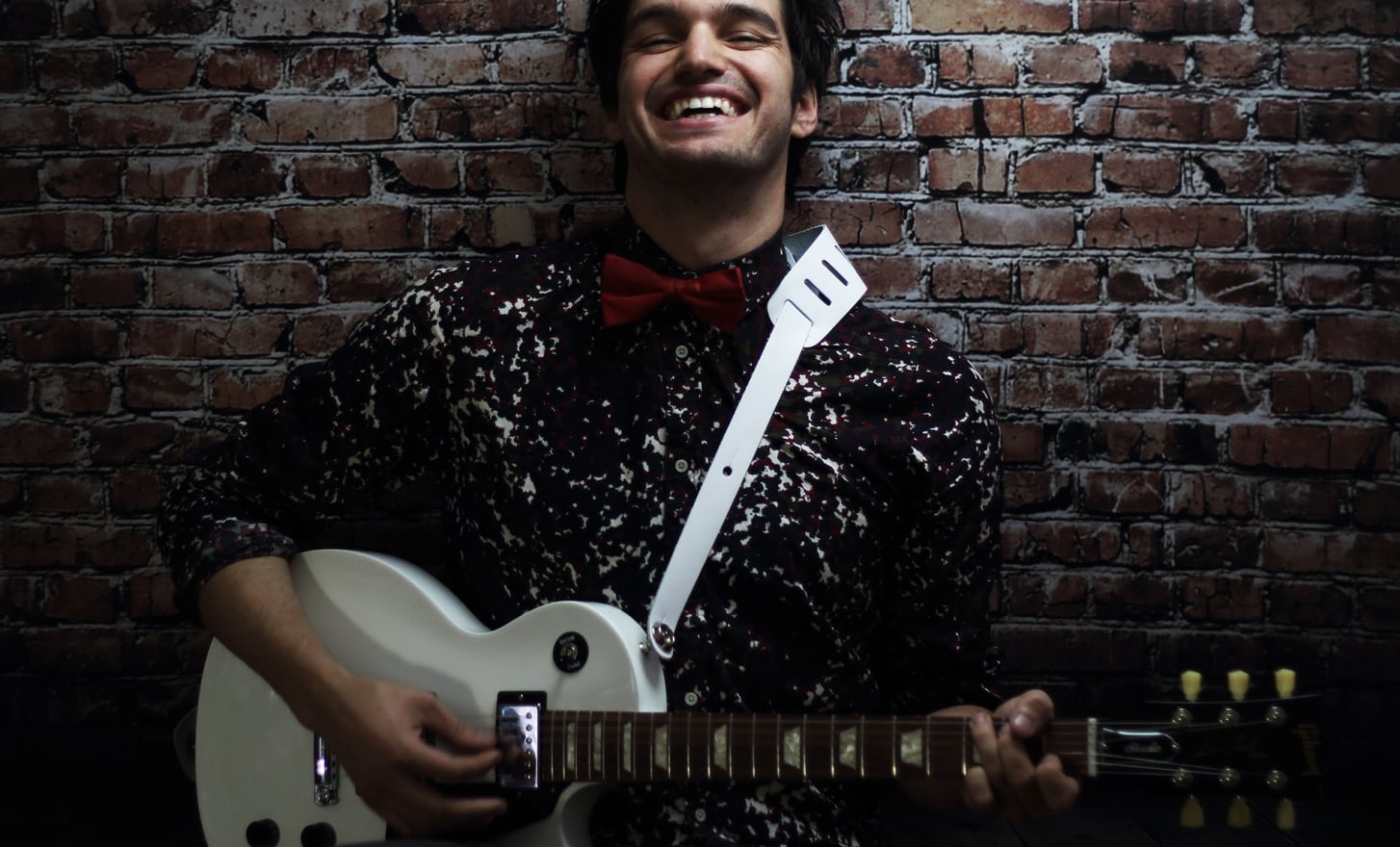 john vicino holding a guitar
