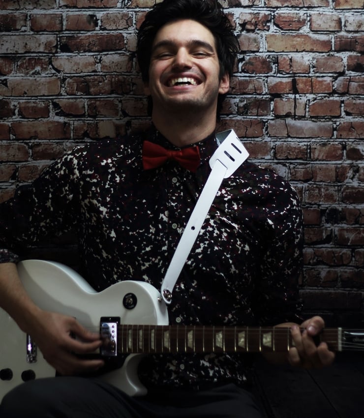 john vicino holding a guitar