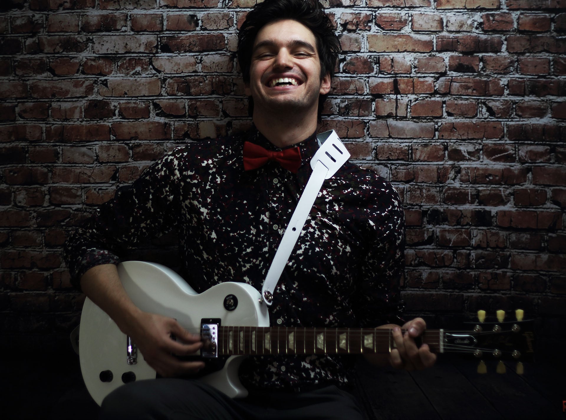 john vicino holding a guitar